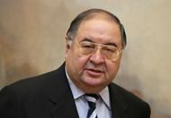 LONDON - NOVEMBER 07:  Russian Oligarch Alisher Usmanov is pictured in front of JMW Turner's painting ' The Harbour of Brest ' in the Tate Britain art gallery on November 7, 2008 in London, England. The Pushkin Museum in Moscow is hosting a major exhibition of works by JMW Turner on loan from Tate Britain thanks to it's sole sponsor, Alisher Usmanov. Mr Usmanov who is a major shareholder in the Russian industrial conglomerate, Metalloinvest, as well as Arsenal Football Club, is reported to have a personal fortune of approximately 2.7bn GBP.    (Photo by Oli Scarff/Getty Images)